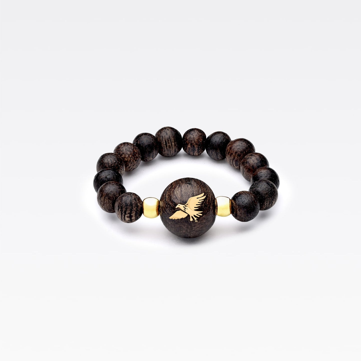 Alignement régulier de perles sphériques en bois d’agar.