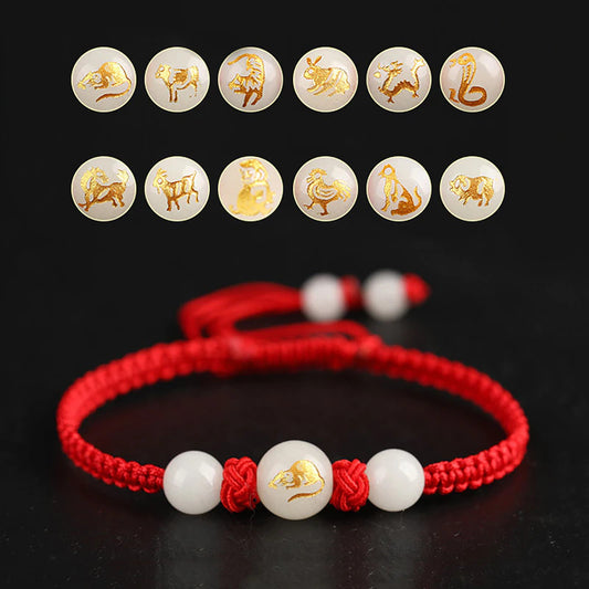 Bracelet Feng Shui rouge en corde cirée avec symbole du zodiaque chinois fluorescent.