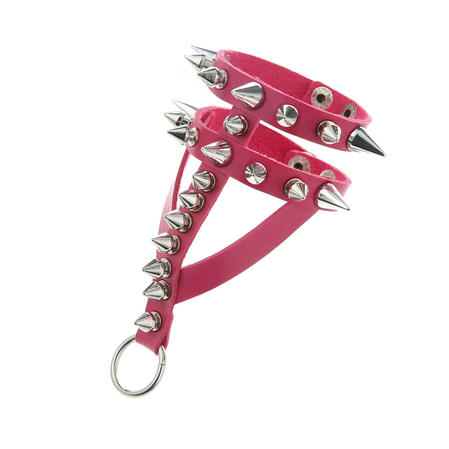 Bracelet fuchsia en cuir synthétique avec rangée de spikes métalliques, vu en angle latéral.